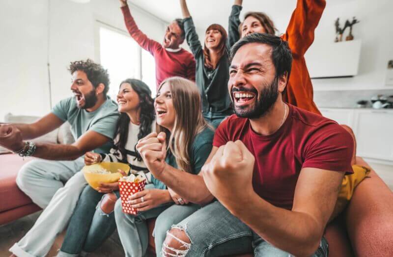 A Group Of Friends Watching Sports On Tv A group of friends watching sports on tv